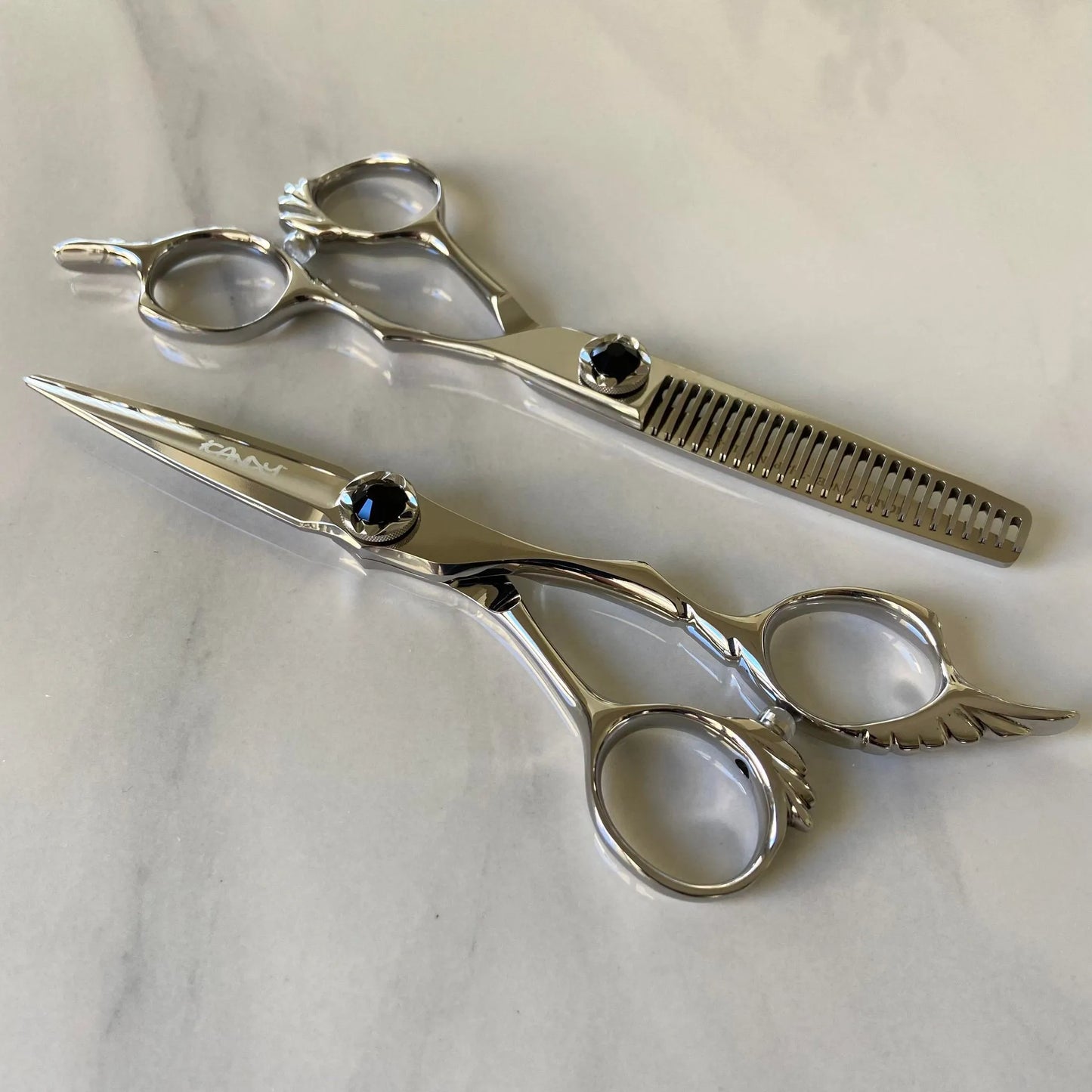 iCandy ANGEL Ice Black Diamond VG10 professional hairdressing scissors and thinning scissors bundle featuring premium Japanese TAKEFU VG10 steel, ergonomic offset handles, precision convex blades and an elegant black diamanté tension screw for professional hairdressers and barbers.