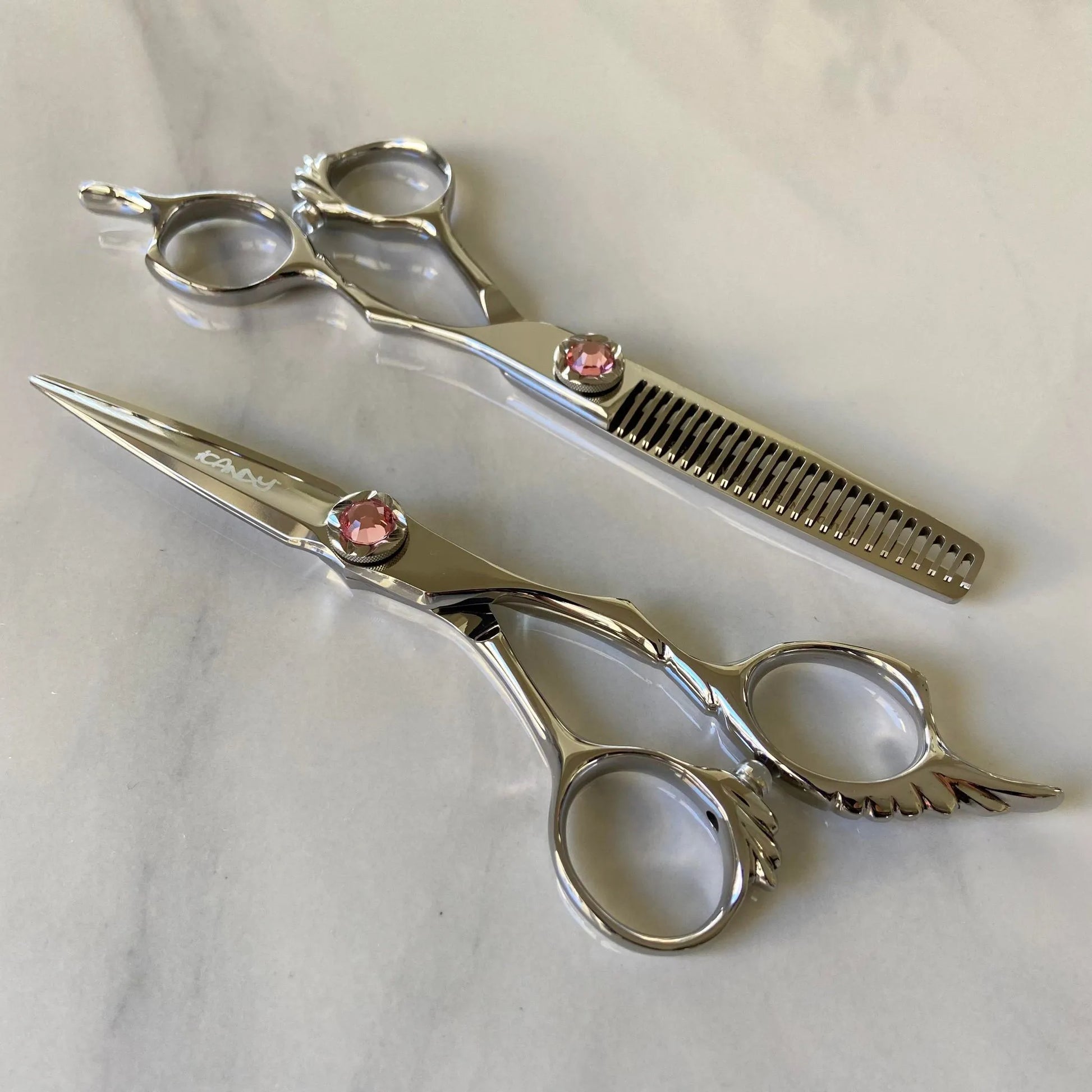 iCandy ANGEL Ice Pink VG10 professional hairdressing scissors and thinning scissors bundle featuring premium Japanese TAKEFU VG10 steel, ergonomic offset handles, precision convex blades and a signature ice pink diamanté tension screw for effortless cutting and seamless texturising.