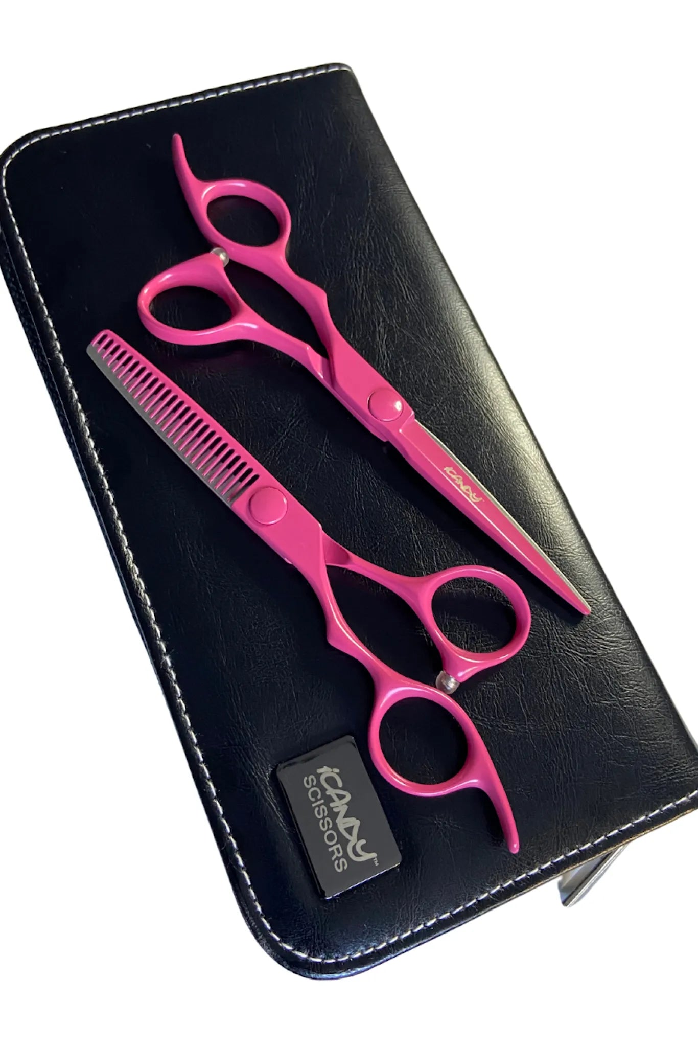 iCandy ELECTRO Sunset Pink VG10 left-handed 6.0 inch cutting scissor and 5.5 inch thinning scissor displayed on the premium iCandy double scissor case, ready for professional salon and barber work.