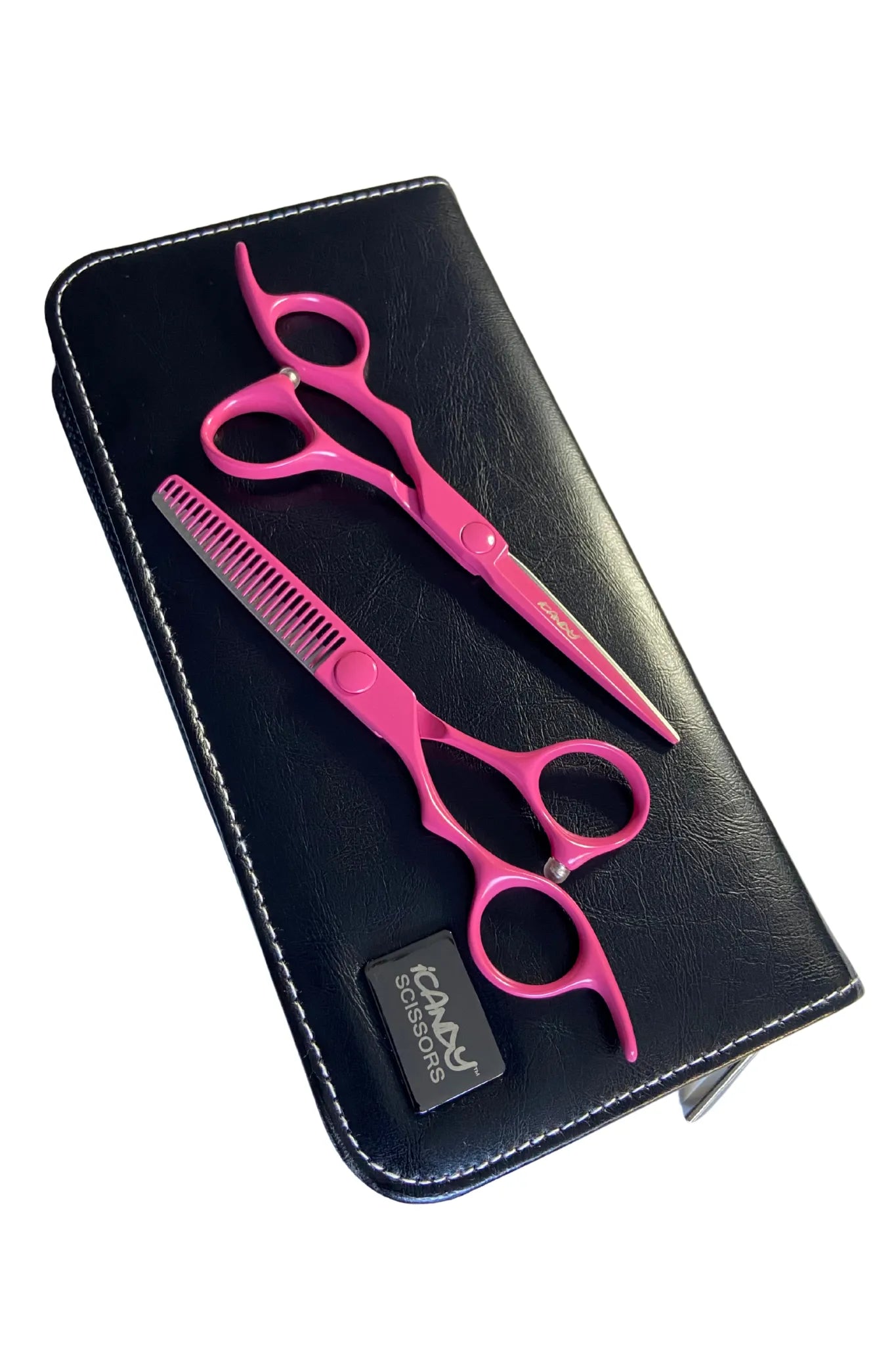 Close-up of the iCandy ELECTRO Sunset Pink VG10 left-handed cutting scissor showcasing Japanese TAKEFU VG10 steel, Sword Mountain convex blade technology and the exclusive Sunset Pink Teflon Nano finish for ultra-smooth precision cutting.