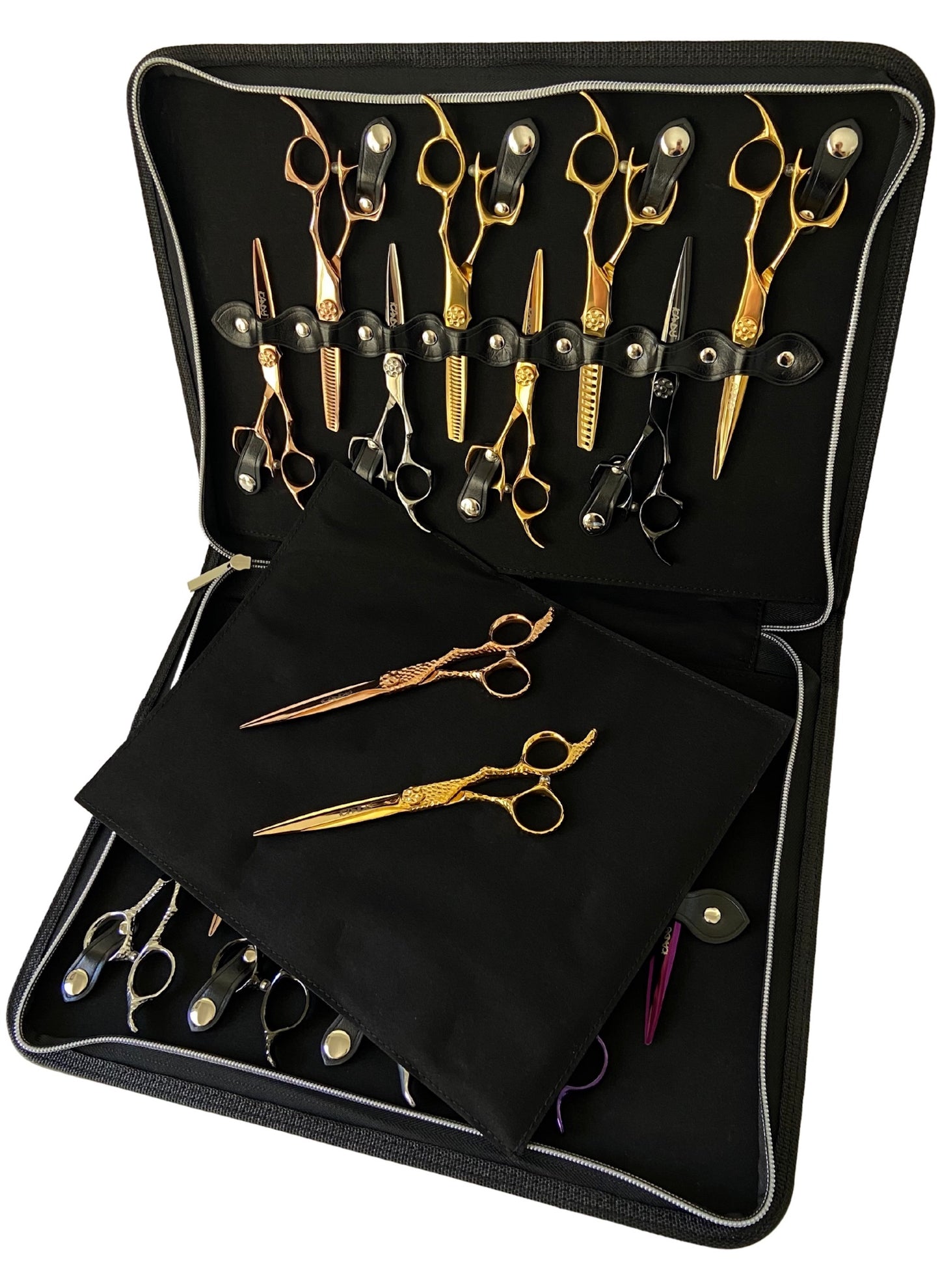 An open iCandy black leather scissor zip case displaying multiple scissor slots with various gold-colored scissors placed inside with soft viewing pad. The case features premium buttons and stitching with a iCandy embossed logo.